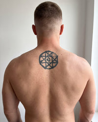 Blood Seal semi-permanent tattoo on upper back