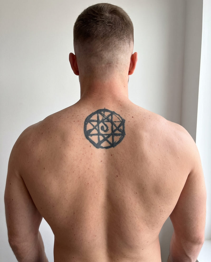 Blood Seal semi-permanent tattoo on upper back