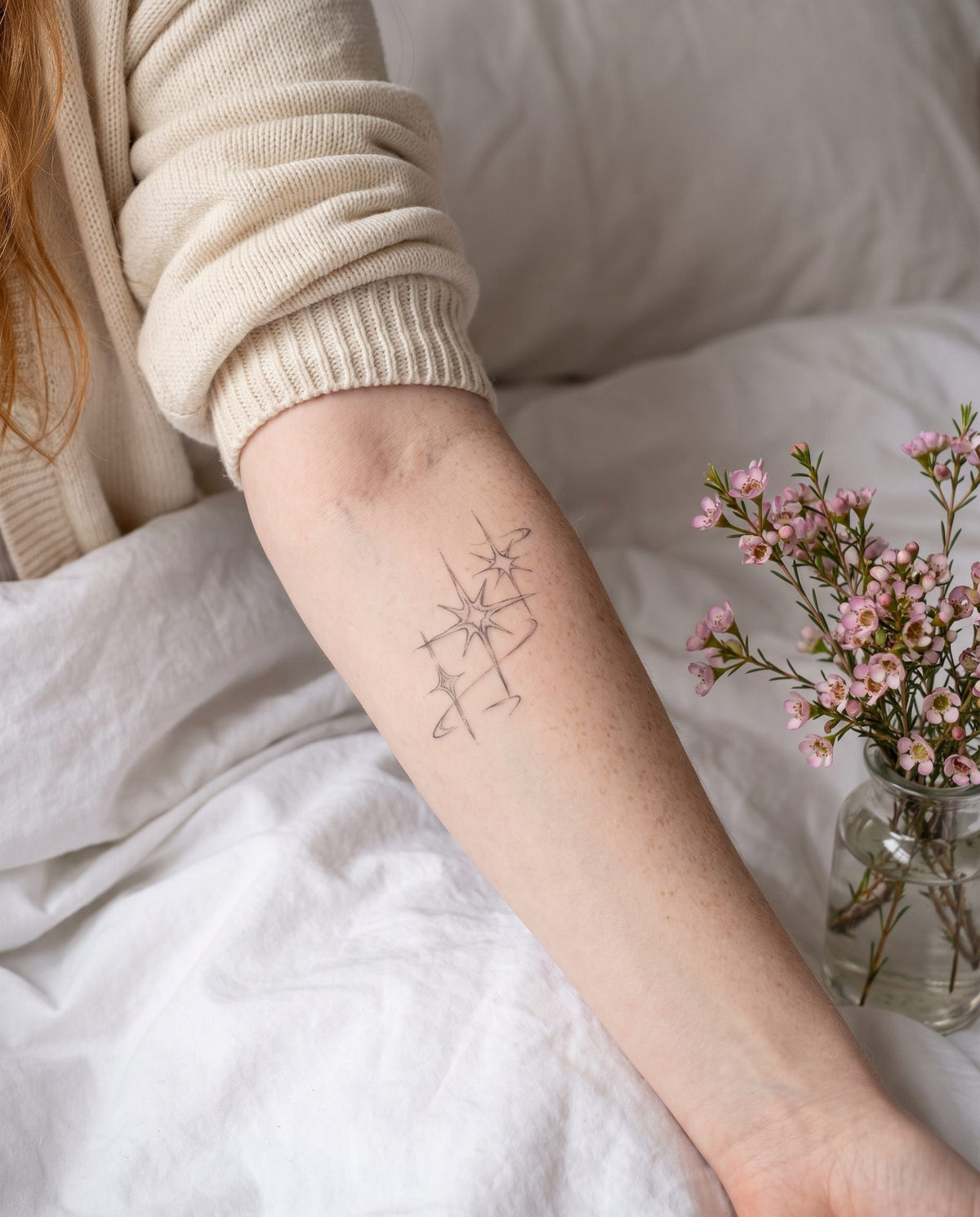Sparkles semi-permanent tattoo on inner forearm