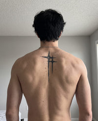 Twin Crosses semi-permanent tattoo on upper back